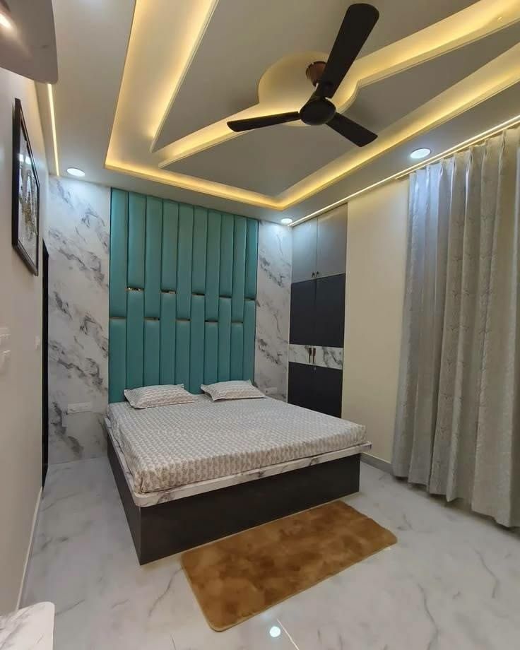 Bedroom with upholstered wall